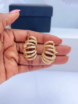 Multi-layer hoop gold earrings with layered circular design and polished gold finish for women