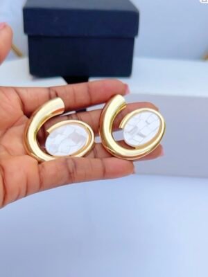 Spiral gold earrings with white stones and elegant twisted design for women