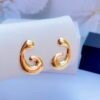 Swirl-shaped gold earrings with a polished spiral design for women