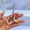 Teardrop hoop gold earrings with polished finish and elegant modern design for women